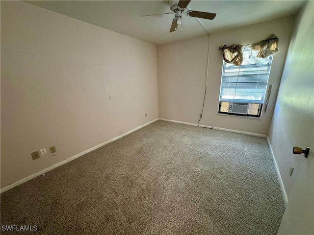 unfurnished room with cooling unit, carpet flooring, ceiling fan, and baseboards