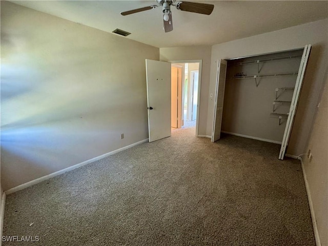 unfurnished bedroom with ceiling fan, carpet flooring, visible vents, baseboards, and a closet