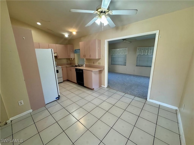 kitchen with light tile patterned floors, lofted ceiling, light countertops, light carpet, and white appliances