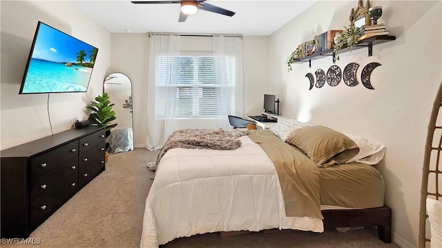 bedroom with a ceiling fan and light colored carpet