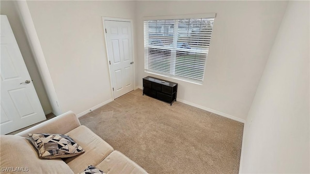 unfurnished bedroom with light carpet and baseboards