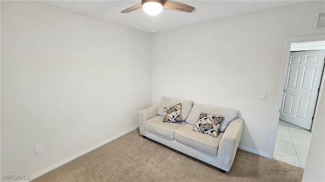 living area featuring light carpet, visible vents, a ceiling fan, and baseboards