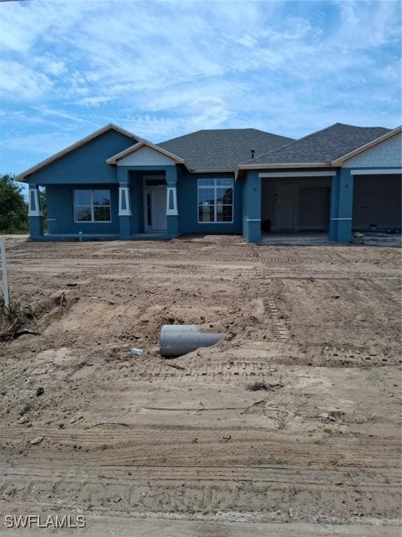 106 SE 5th Ave, Cape Coral, FL 33990 - view of front of home featuring a garage