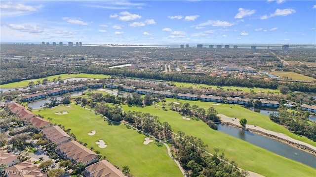 aerial view featuring view of golf course, a water view, and a city view