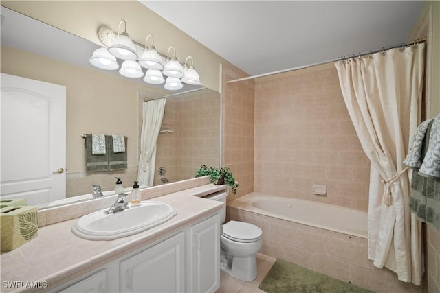 bathroom with tile patterned flooring, tiled shower / bath combo, vanity, and toilet