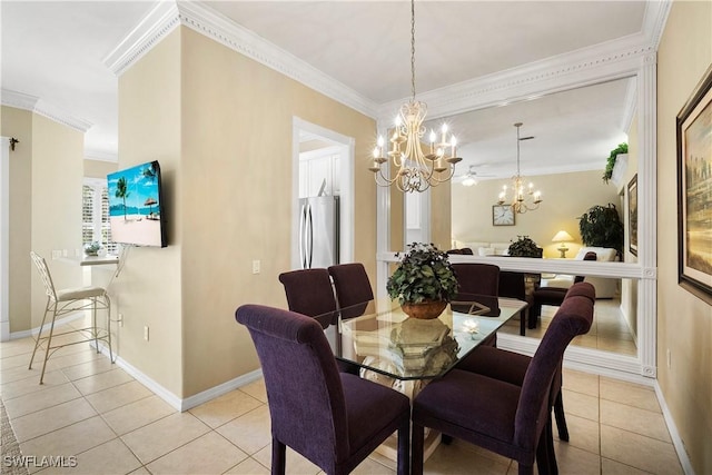 dining area featuring baseboards, ornamental molding, a notable chandelier, and light tile patterned flooring