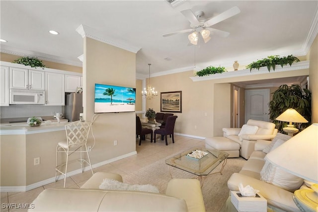 living room with ceiling fan with notable chandelier, ornamental molding, light tile patterned flooring, and baseboards