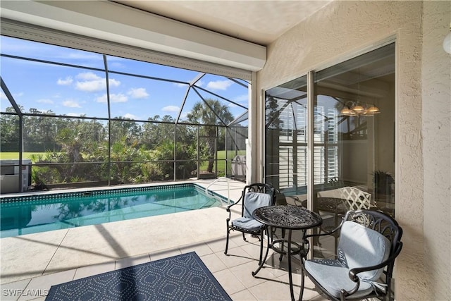 outdoor pool with a patio area and a lanai