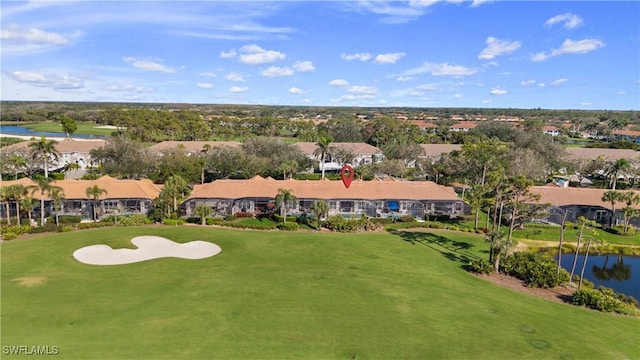 birds eye view of property featuring a residential view, a water view, and golf course view