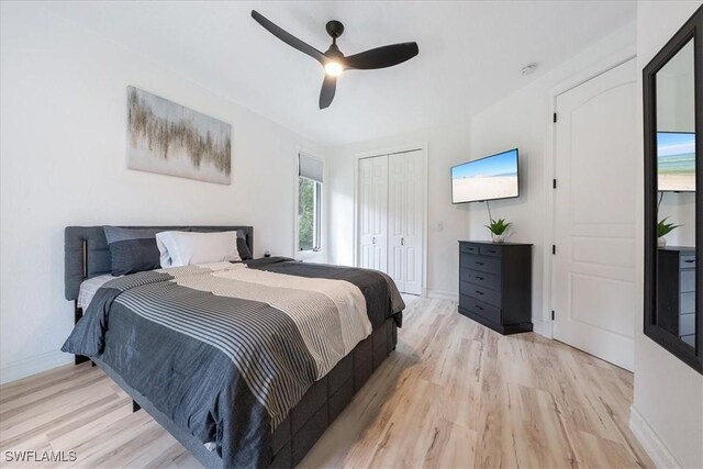 1240 Desoto Blvd S, Naples, FL 34117 - bedroom with light wood-style flooring, a closet, and ceiling fan