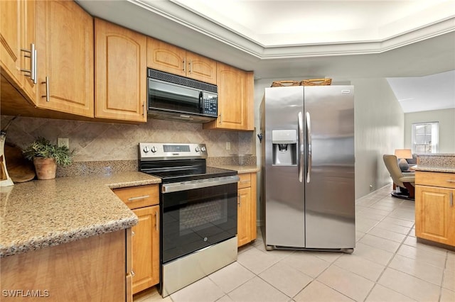 kitchen featuring light tile patterned floors, stainless steel appliances, tasteful backsplash, and light stone countertops