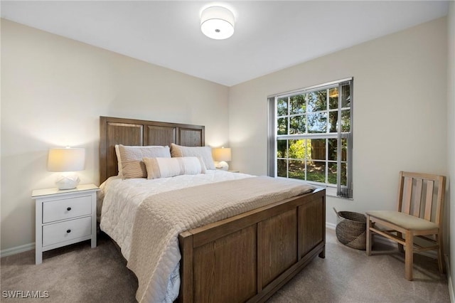 carpeted bedroom with baseboards