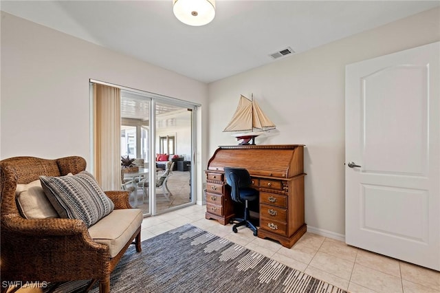 office area with visible vents, baseboards, and light tile patterned floors