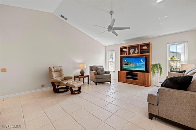 living room featuring light tile patterned floors, lofted ceiling, visible vents, baseboards, and a ceiling fan