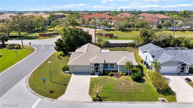 birds eye view of property with a residential view