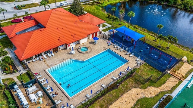 birds eye view of property with a water view