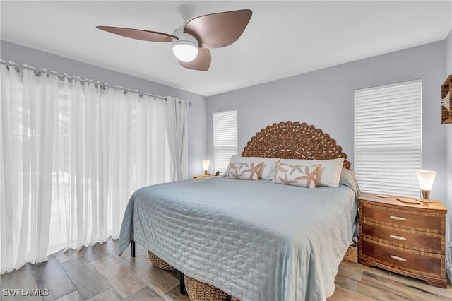 8080 Lagoon Rd, Fort Myers Beach, FL 33931 - bedroom featuring wood finished floors and ceiling fan