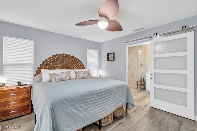 8080 Lagoon Rd, Fort Myers Beach, FL 33931 - bedroom with wood finished floors, ceiling fan, and ensuite bath