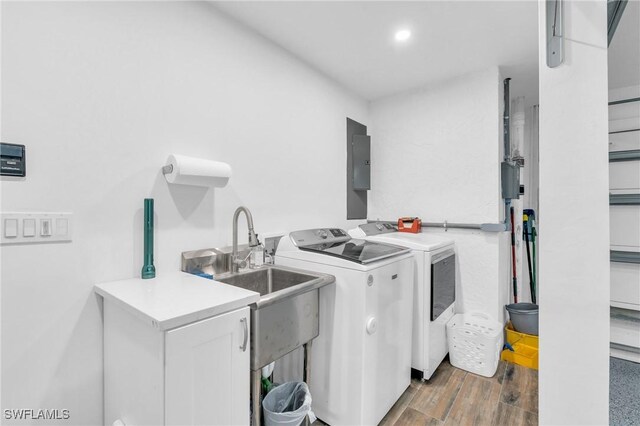 8080 Lagoon Rd, Fort Myers Beach, FL 33931 - laundry room featuring separate washer and dryer, wood finished floors, recessed lighting, and electric panel