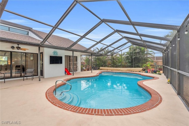 pool with a patio and a lanai