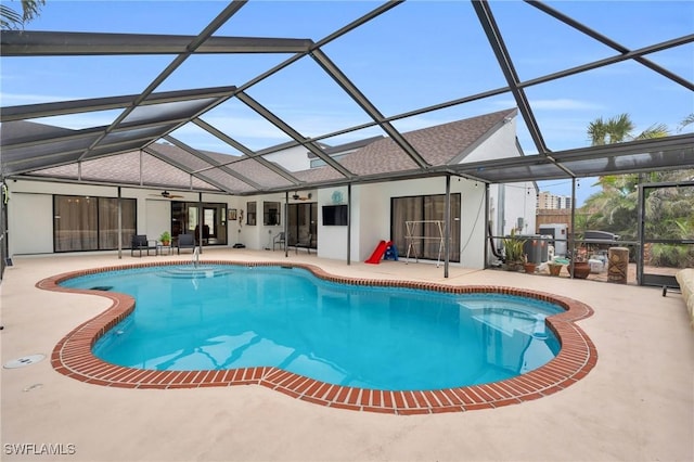 8080 Lagoon Rd, Fort Myers Beach, FL 33931 - outdoor pool with a ceiling fan, a patio area, and glass enclosure