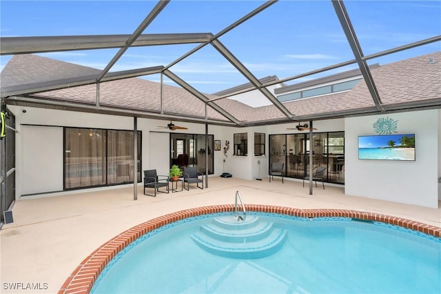 8080 Lagoon Rd, Fort Myers Beach, FL 33931 - rear view of house featuring a ceiling fan, a shingled roof, a patio area, and stucco siding