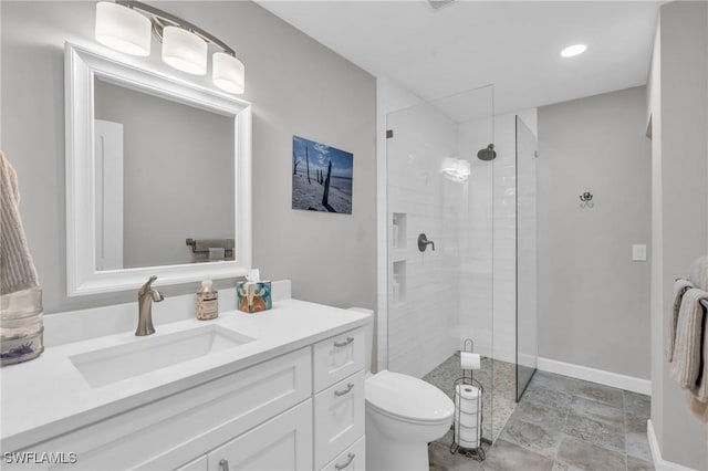 8080 Lagoon Rd, Fort Myers Beach, FL 33931 - bathroom with toilet, a shower stall, vanity, stone finish floors, and recessed lighting