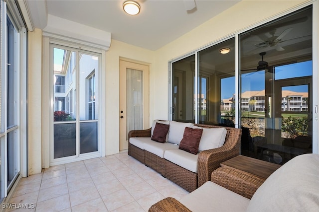 sunroom with a ceiling fan