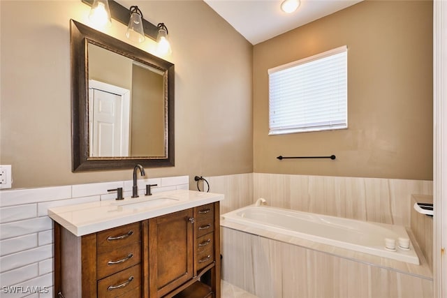 bathroom featuring vanity and a bath