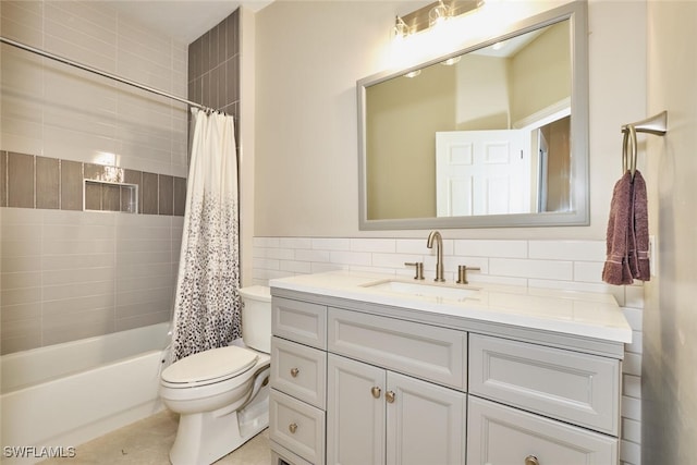 full bathroom with a wainscoted wall, tile walls, toilet, shower / bath combo, and vanity