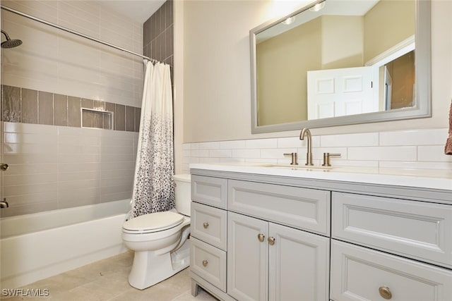 full bathroom featuring tile walls, toilet, shower / bath combo, vanity, and tile patterned floors