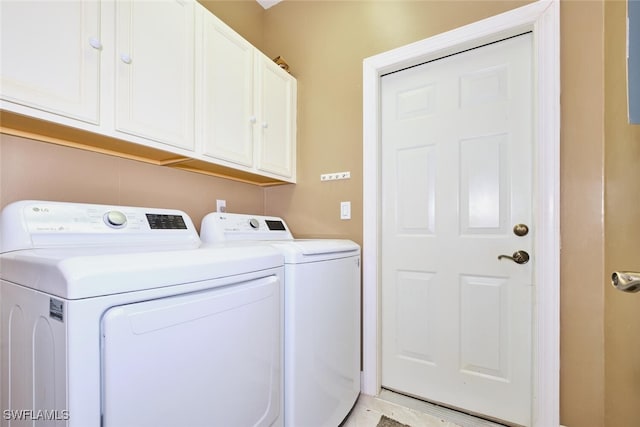 laundry room featuring cabinet space and washer and dryer