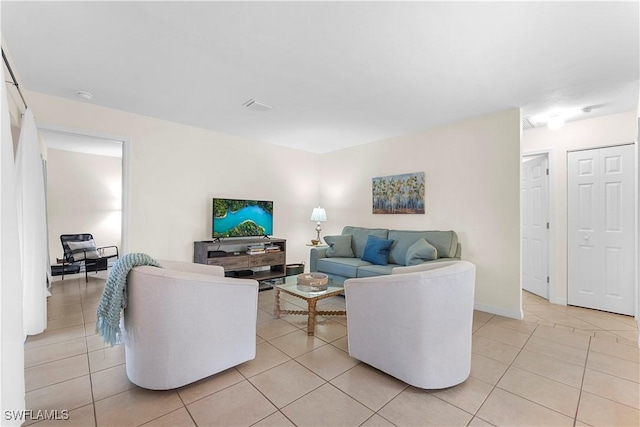 living room with visible vents and light tile patterned floors