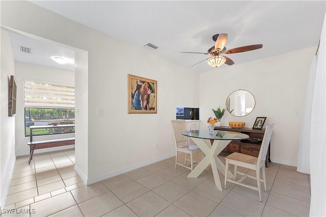 dining area with light tile patterned floors, ceiling fan, and visible vents