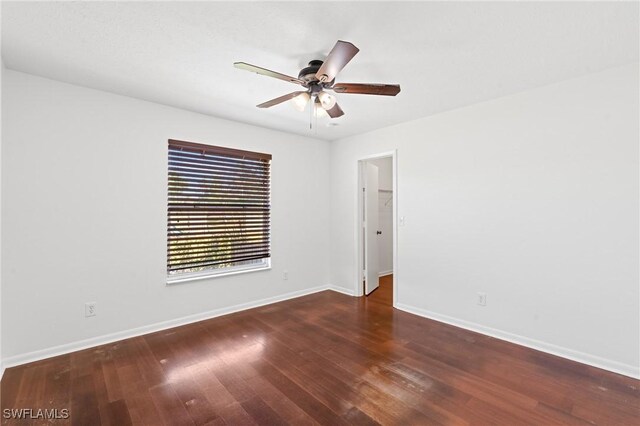 6451 Scott Ln, Fort Myers, FL 33966 - unfurnished room with ceiling fan, wood finished floors, and baseboards