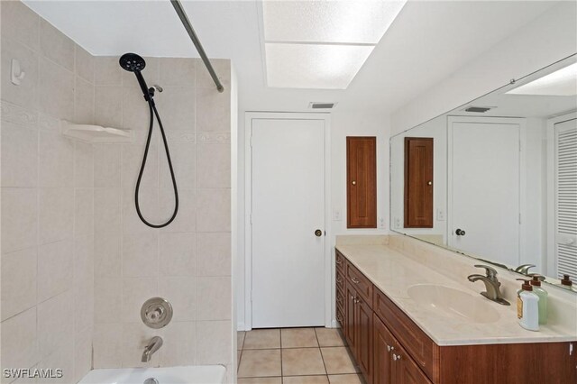 6451 Scott Ln, Fort Myers, FL 33966 - bathroom featuring shower / washtub combination, visible vents, vanity, and tile patterned floors