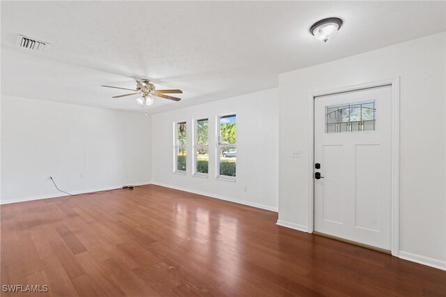 6451 Scott Ln, Fort Myers, FL 33966 - entryway with baseboards, visible vents, ceiling fan, and wood finished floors