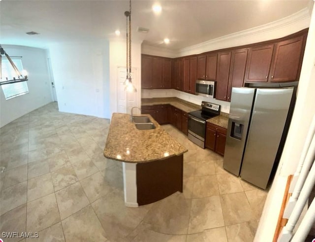 kitchen with a center island with sink, stainless steel appliances, ornamental molding, a sink, and light stone countertops