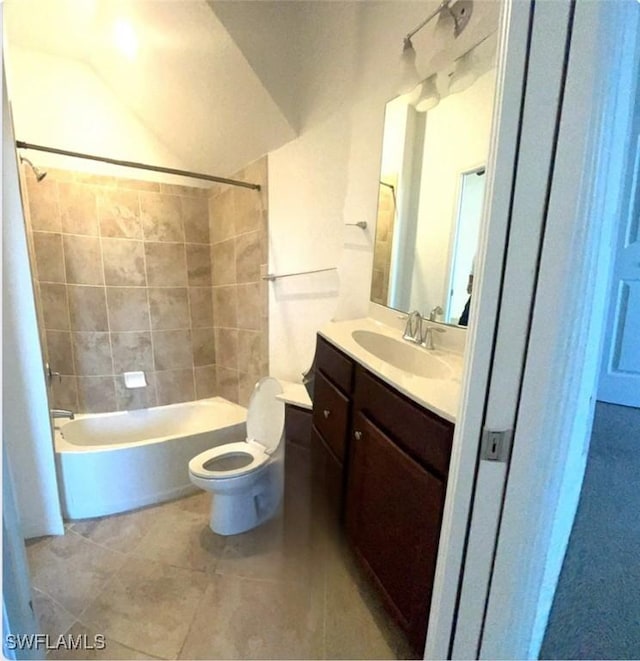 full bath with shower / washtub combination, tile patterned flooring, vanity, and toilet