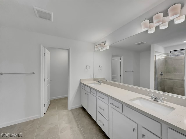 full bathroom featuring double vanity, visible vents, and a sink