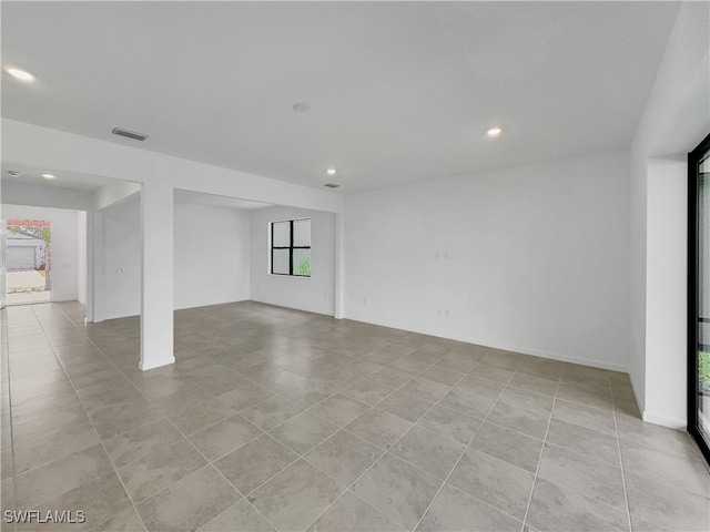 spare room with recessed lighting, visible vents, and light tile patterned floors