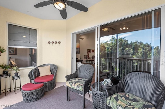 sunroom / solarium with ceiling fan