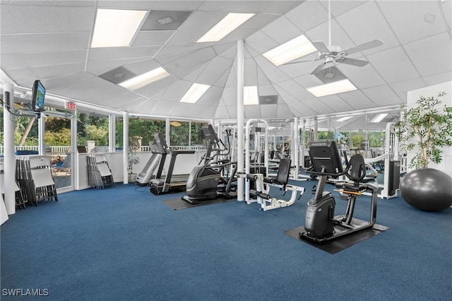 exercise room featuring a ceiling fan and a paneled ceiling