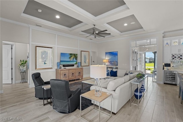 living room featuring beverage cooler, coffered ceiling, ornamental molding, wood tiled floor, and french doors