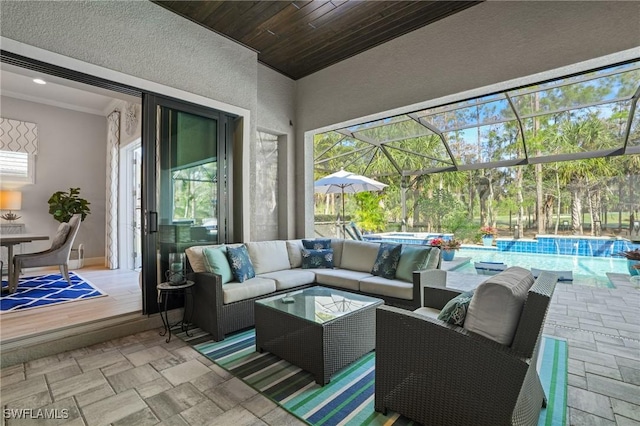 view of patio / terrace with an outdoor hangout area, glass enclosure, and an outdoor pool