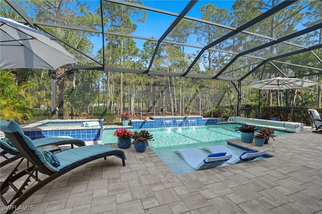 outdoor pool featuring a patio area, a hot tub, and glass enclosure