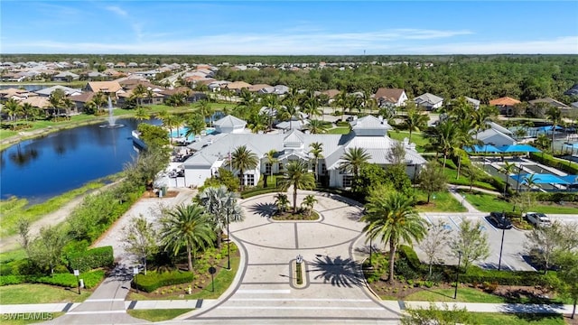 birds eye view of property with a water view and a residential view