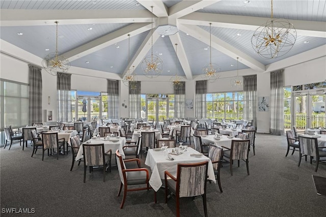 carpeted dining area featuring high vaulted ceiling, a chandelier, beamed ceiling, and french doors