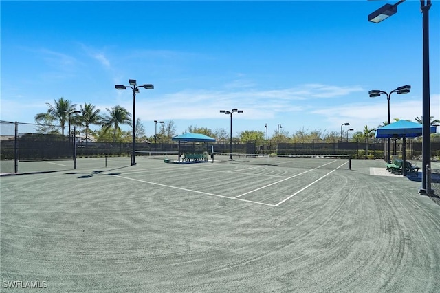 view of sport court with fence