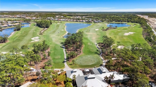 drone / aerial view featuring view of golf course and a water view